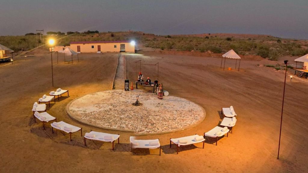 Aerial view of desert camp circular plaza at dusk