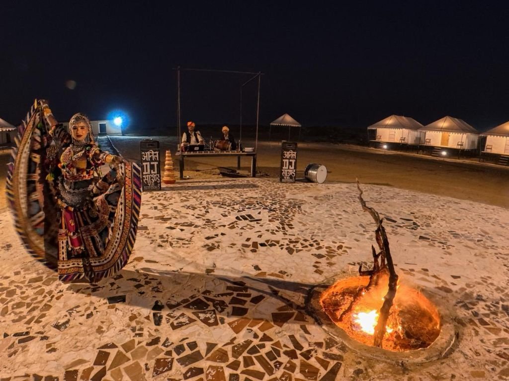 Bonfire with folk dancer performing at night
